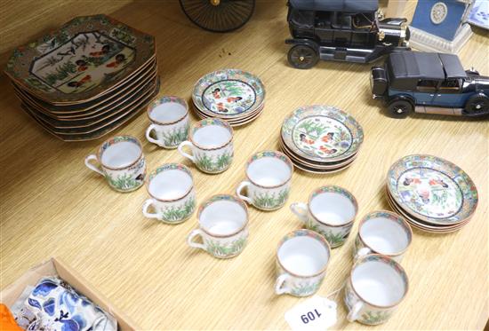 A set of Chinese famille rose cockerel cups, saucers and plates, early 20th century